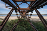 Fototapeta Łazienka - Historic steel bridge on the beach of the river Elbe.
