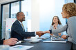 © peopleimages.com - Business people, lawyers or shaking hands in meeting for deal, b2b collaboration or teamwork in office. Handshake, partnership or attorneys in corporate agreement for negotiation, merger or hiring
