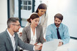 © peopleimages.com - Group, business and people in office with laptop for strategy, meeting with collaboration for pitch. Diversity, workplace or coworking with computer for review of company, leader or manager with plan
