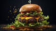 jumbo hamburger stock photo, isolated in black