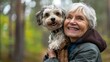 © Joyce - Dog and a senior person in outdoor park