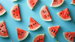 Colorful fruit pattern of fresh watermelon slices on blue background, From top view