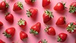 Colorful pattern of strawberries on pink background, Top view