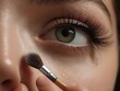 make up artist applying mascara to a beautiful eye