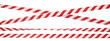 © Vitaly - Isolated crossed warning tape with red and white stripes. Stretched and twisted caution ribbon.