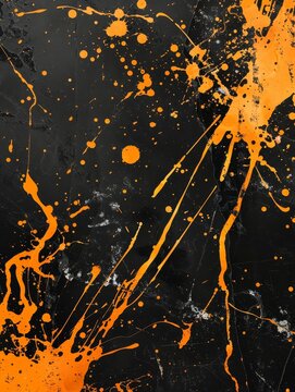 Vibrant orange paint splatters on a black background