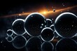 A series of black spheres with a bright orange sun in the background