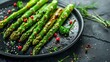 Dynamic food photography of asparagus on black plate and cutting board in hard light
