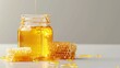 Jar overflowing with honey next to honeycombs - An overflowing glass honey jar with a rich, golden honey surrounded by raw honeycombs on a gloss surface