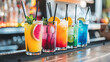 © YOGI C - cocktail hour at the bar with a variety of drinks served in tall and colorful glasses, accompanied