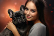 Image of girl hugging french bulldog showing friendship. Pet. People and pets.