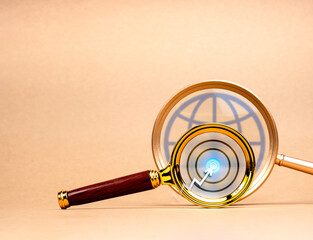 Aufkleber - Internet online data searching, worldwide information search engine on browser networking concept. Arrow hit on target icon on magnifying glass lens on digital global icon on eco brown background.