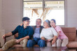 Senior mother and father, middle-aged son and daughter in living room, Happiness Asian family concepts