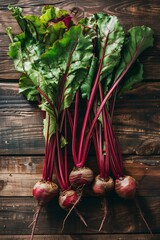 Wall Mural - freshly picked organic beets from the field on the wooden surface. above view