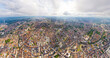 Ghent, Belgium. City center and surroundings. Residential and industrial areas. Panorama of the city. Summer day, cloudy weather. Aerial view