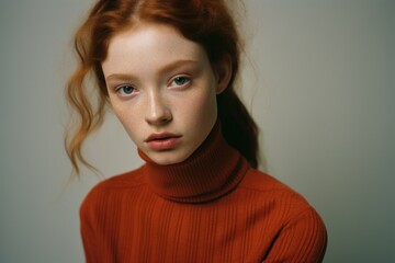 Sticker - a woman with red hair and freckles wearing a turtleneck