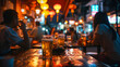 Atmospheric evening at an Asian street bar bokeh lights in the background people socializing over beer and meals