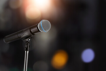 Wall Mural - Microphone for press conference speaker report interview concepts or broadcasting public speaking speech presentation stage performance and reporter news with empty copy space background.