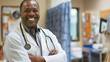 Smiling doctor with stethoscope ready to assist