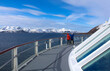 Tourist couple on cruise boat deck in Norway