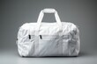 © Horsi - a blank white duffel bag, meticulously styled and photographed against a crisp and seamless white background