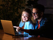 business young friend night couple student laptop computer office businessman businesswoman entertainment tv watching television movie startup evening glowing screen