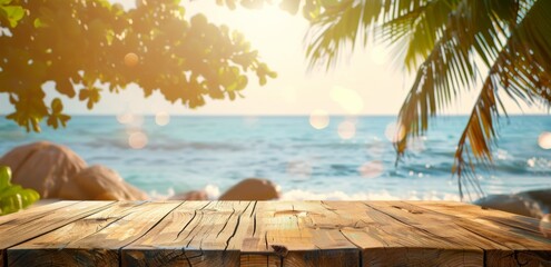 Wall Mural - Photo of Wooden table on tropical beach with palm leaves and blue sea background