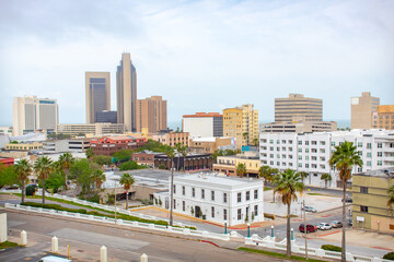 Corpus Christi, Texas - March 15, 2020: Downtown Corpus Christi skyline buildings along the Gulf Of Mexico. Taken in Corpus Christi Texas on a cloudy overcast day