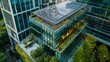 © Ilia Nesolenyi - A birds eye view of a modern glass office building with a green roof and sustainable features like solar panels