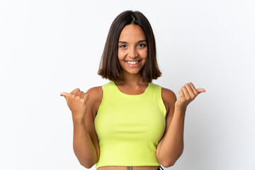 Wall Mural - Young latin woman isolated on white background with thumbs up gesture and smiling