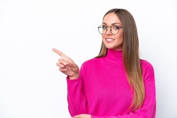 Wall Mural - Young caucasian woman isolated on white background pointing finger to the side