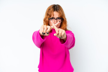 Wall Mural - Young caucasian woman isolated on white background making stop gesture with her hand to stop an act