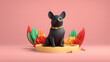 A black dog is sitting on a pedestal with flowers around it