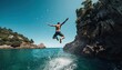 © Anna - A man is leaping off a cliff and plunging into the ocean below in an extreme sports adventure