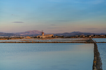 Canvas Print - view of the windmill and salt flat museum of Paceco at sunset