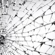 Monochrome image capturing the complex web of cracks in a shattered glass pane