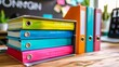 Colorful documents standing on table