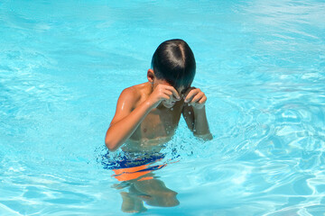 Boy  eyes stung by pool chlorine. Eye irritation for chlorine