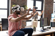 © Wavebreak Media - A diverse team, including an Asian male, explores virtual reality in a modern office
