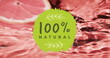Image of 100 percent natural text over fruit falling in water background
