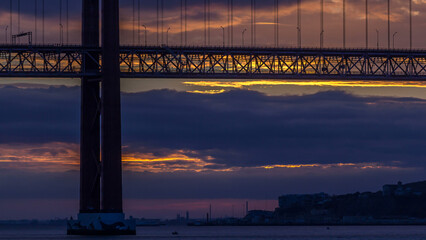 Wall Mural - Lisbon city sunrise with April 25 bridge timelapse