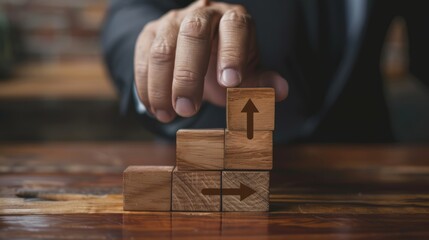 Wooden cubes in the shape of a ladder with a hand on isolated white background close-up. directional arrow sign. accelerate