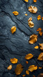 Autumn leaves on black slate background