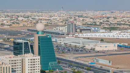 Wall Mural - Cityscape of Ajman from rooftop with modern buildings timelapse.