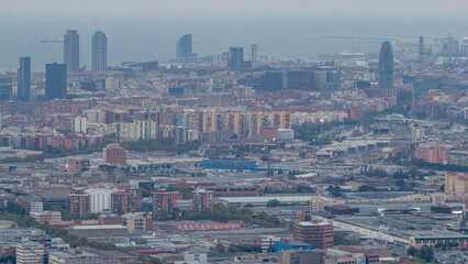 Wall Mural - Barcelona and Badalona skyline with roofs of houses and sea on the horizon at evening timelapse