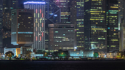 Wall Mural - Hong Kong night view of skyline with reflections at victoria harbor timelapse