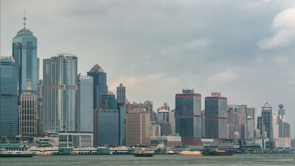 Wall Mural - Hong Kong skyline in the morning over Victoria Harbor timelapse.