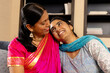 © Wavebreak Media - Indian mother and teenage daughter, sitting close at home, sharing warm moment