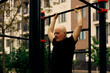 Senior man doing sports on fitness outdoor training stations