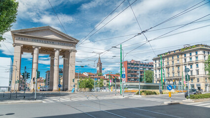 Wall Mural - Street view on Ticinese city gate and tram timelapse in Milan.